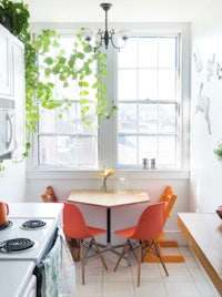 a small kitchen with a table and chairs